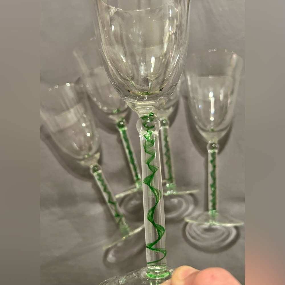 Set of 5 vintage wine glasses with green, swirl filament in the stems.